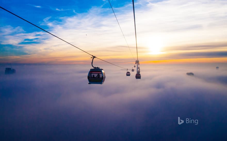 The Emirates Air Line across the River Thames in London at sunset