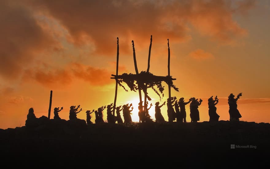 Dancers on the site of a lele (altar) on Mount Maunaloa, Molokai, Hawaii