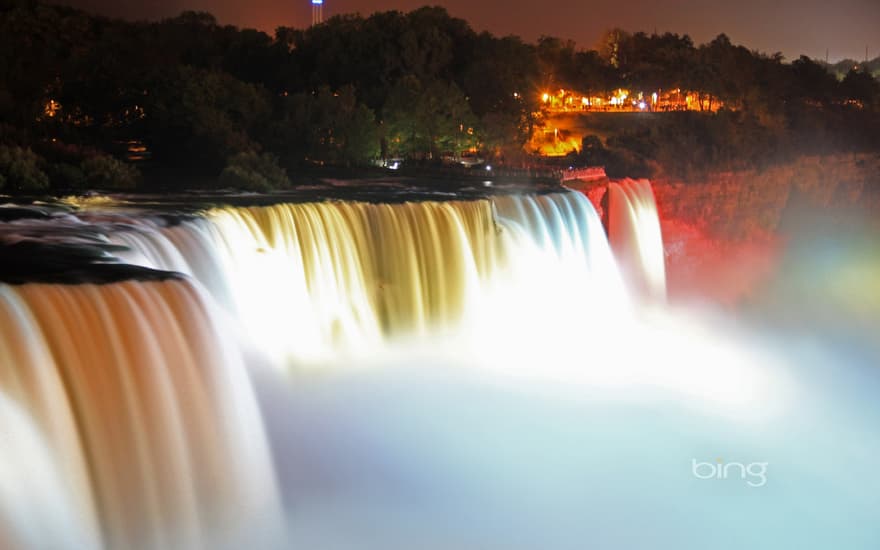 Illuminated American Falls, part of Niagara Falls, seen from the Prospect Point Park observation tower in Niagara Falls, New York