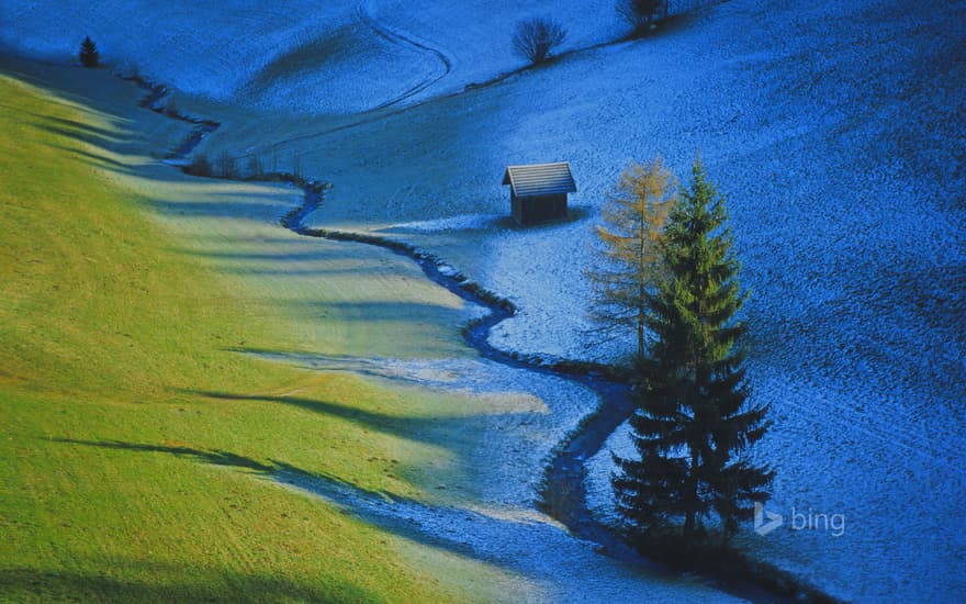 Sun defrosts half a meadow in Tulfes, Austria